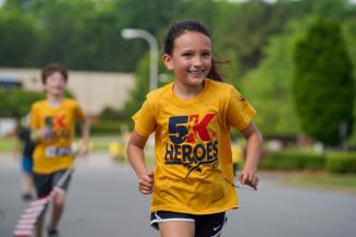 ATD small child running during 5K event
